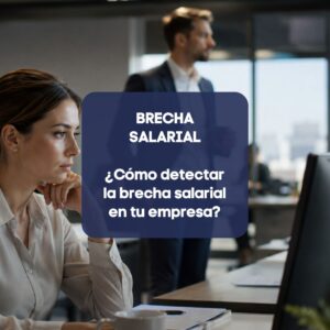 Profesionales trabajando en una oficina mientras se analiza la brecha salarial en la empresa